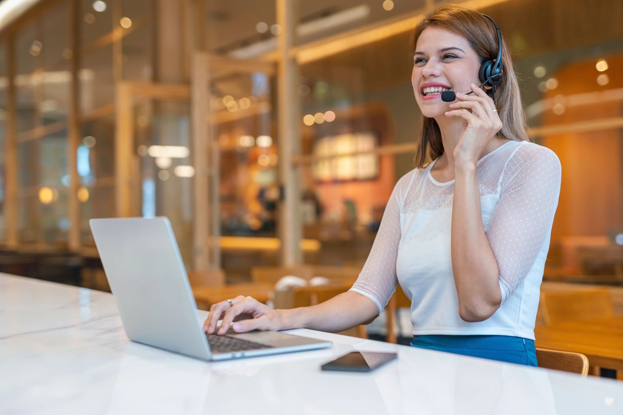 Customer support staff working from a cafe workspace