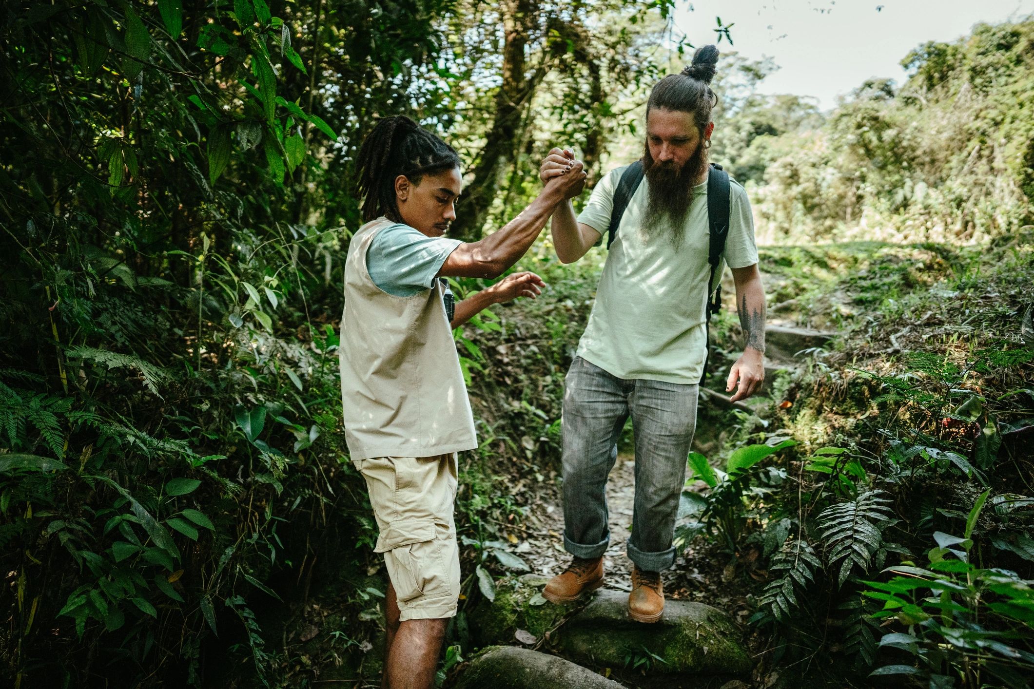 Guide helping a hiker on a trail