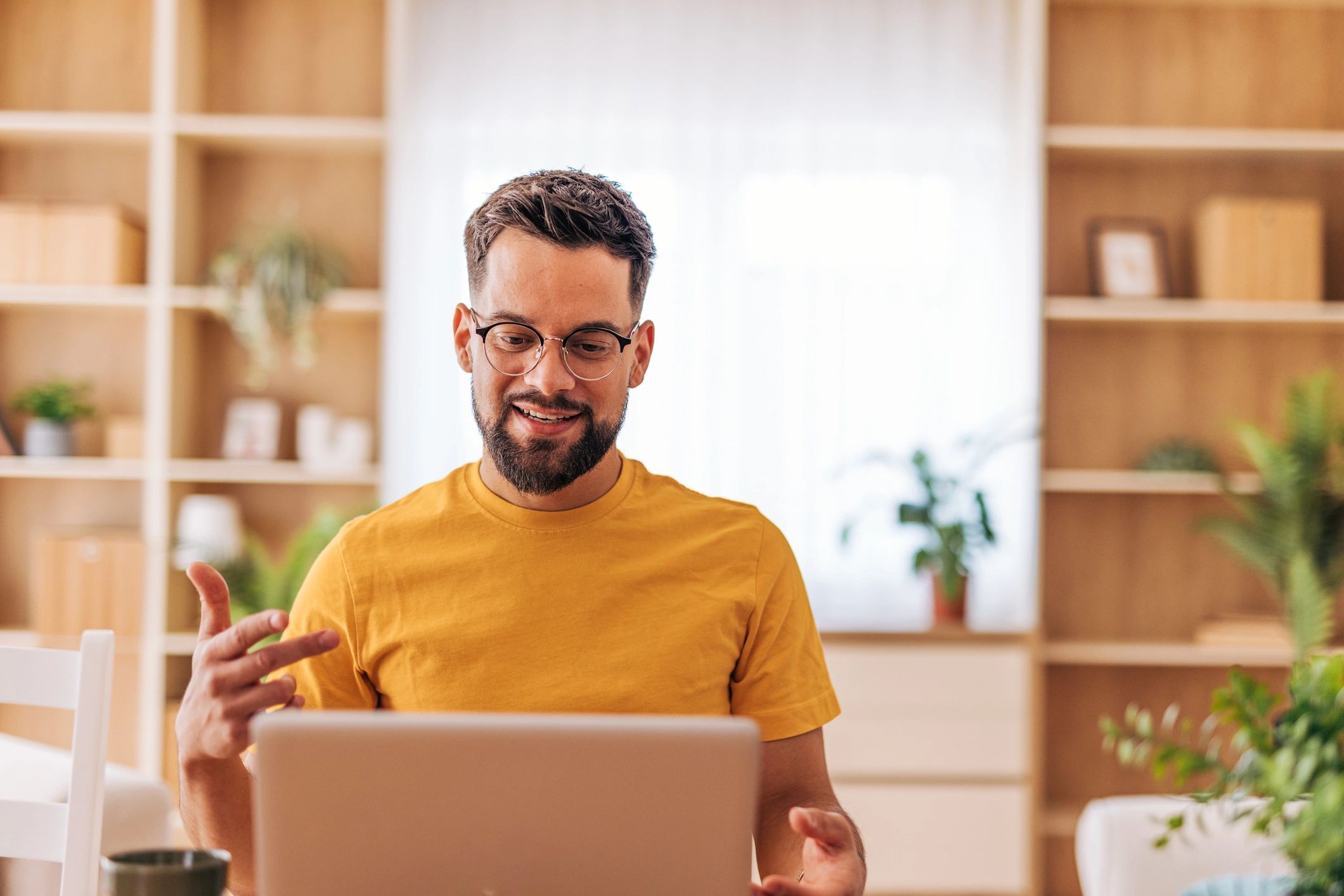Person using a laptop for online chat support